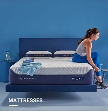 image of lady sitting on edge of mattress