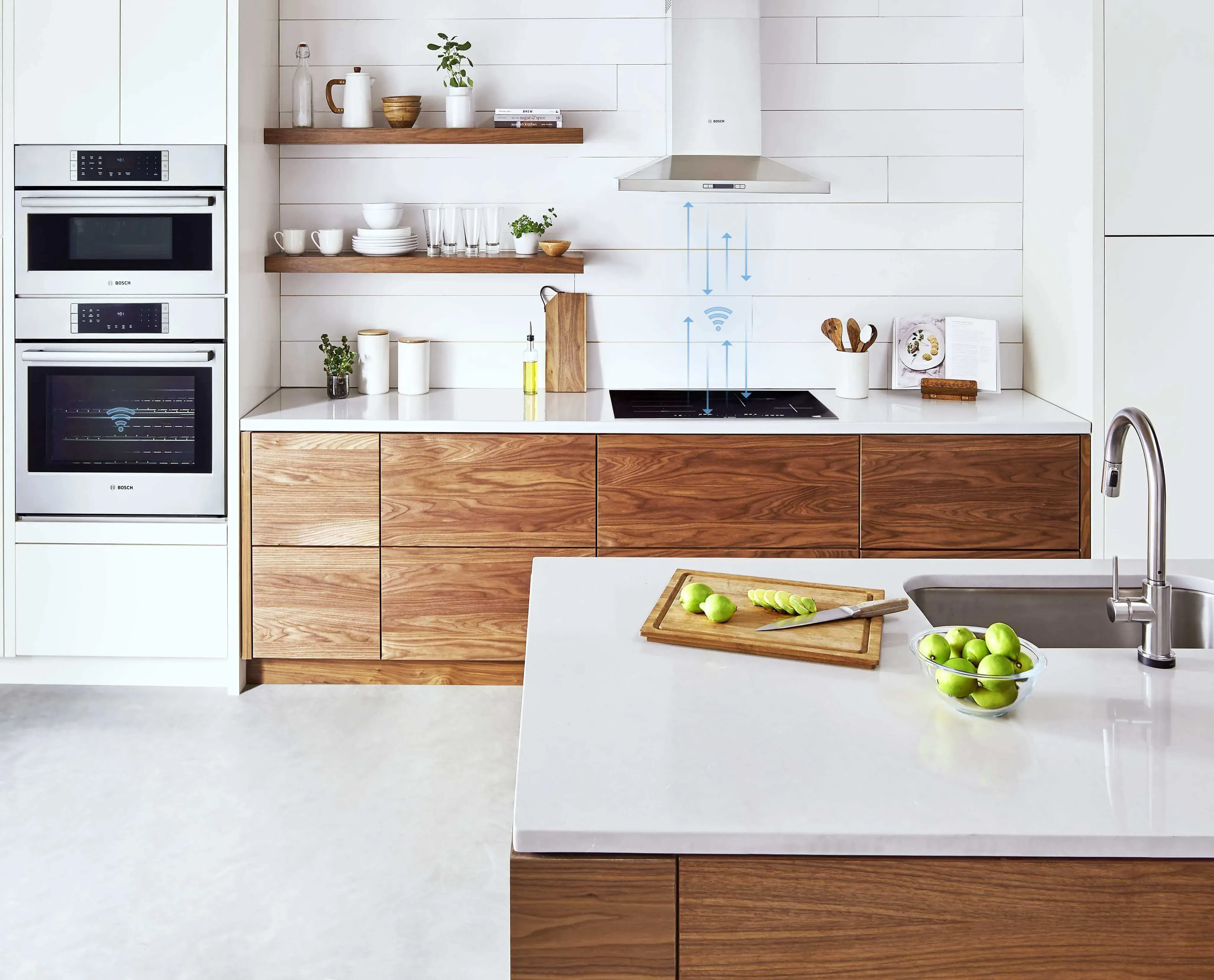 Light colored kitchen with stainless steel Bosch appliances