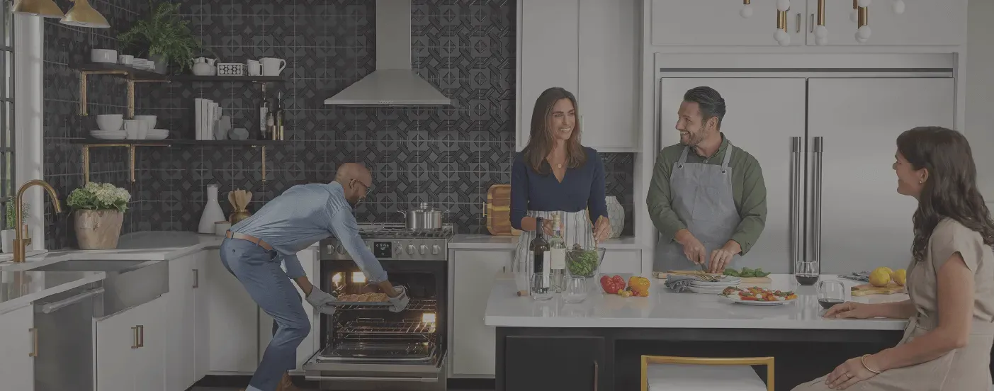 Four adults having a dinner party