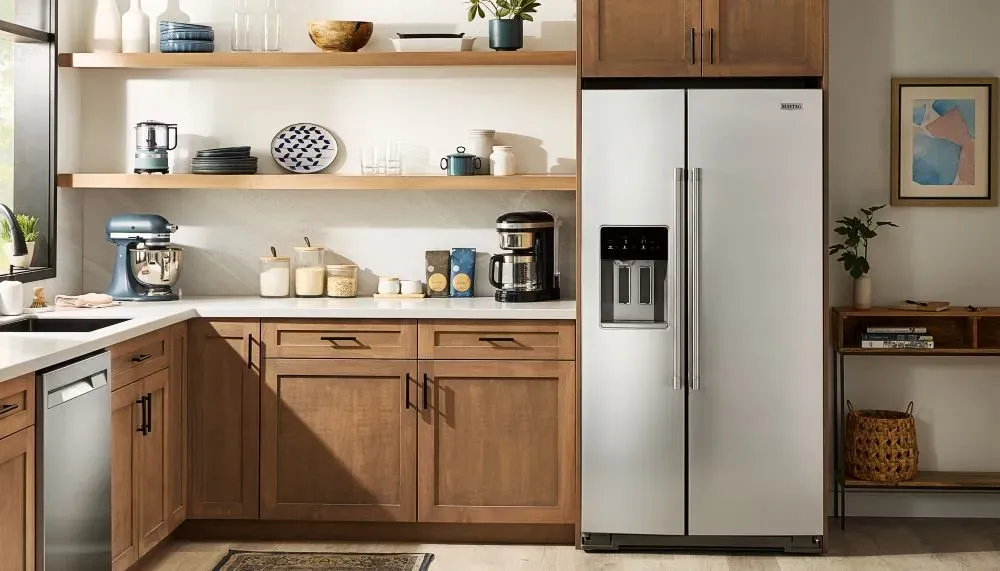 kitchen image with maytag refrigerator and dishwasher in stainless steel finish