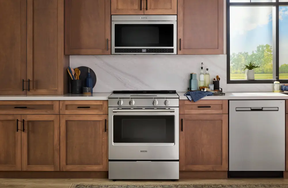 kitchen image of maytag microwave, range and dishwasher with stainless steel finish