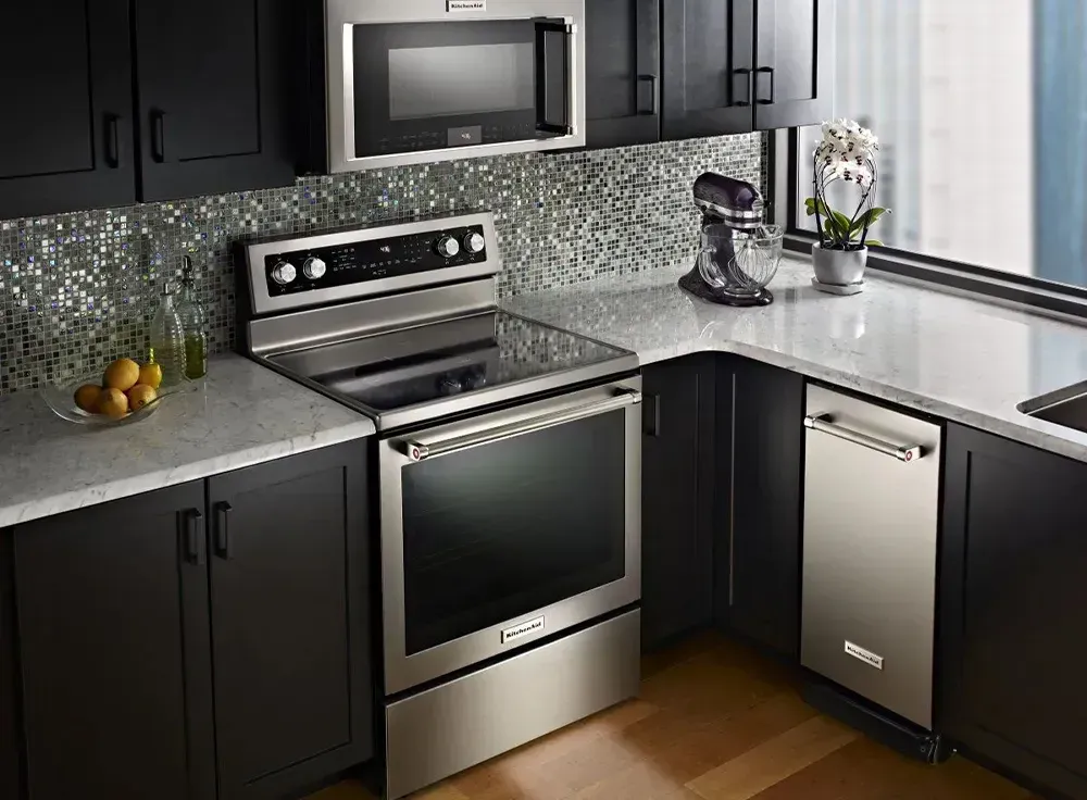 slide 1 lifestyle kitchen image with cooktop, microwave and dishwasher