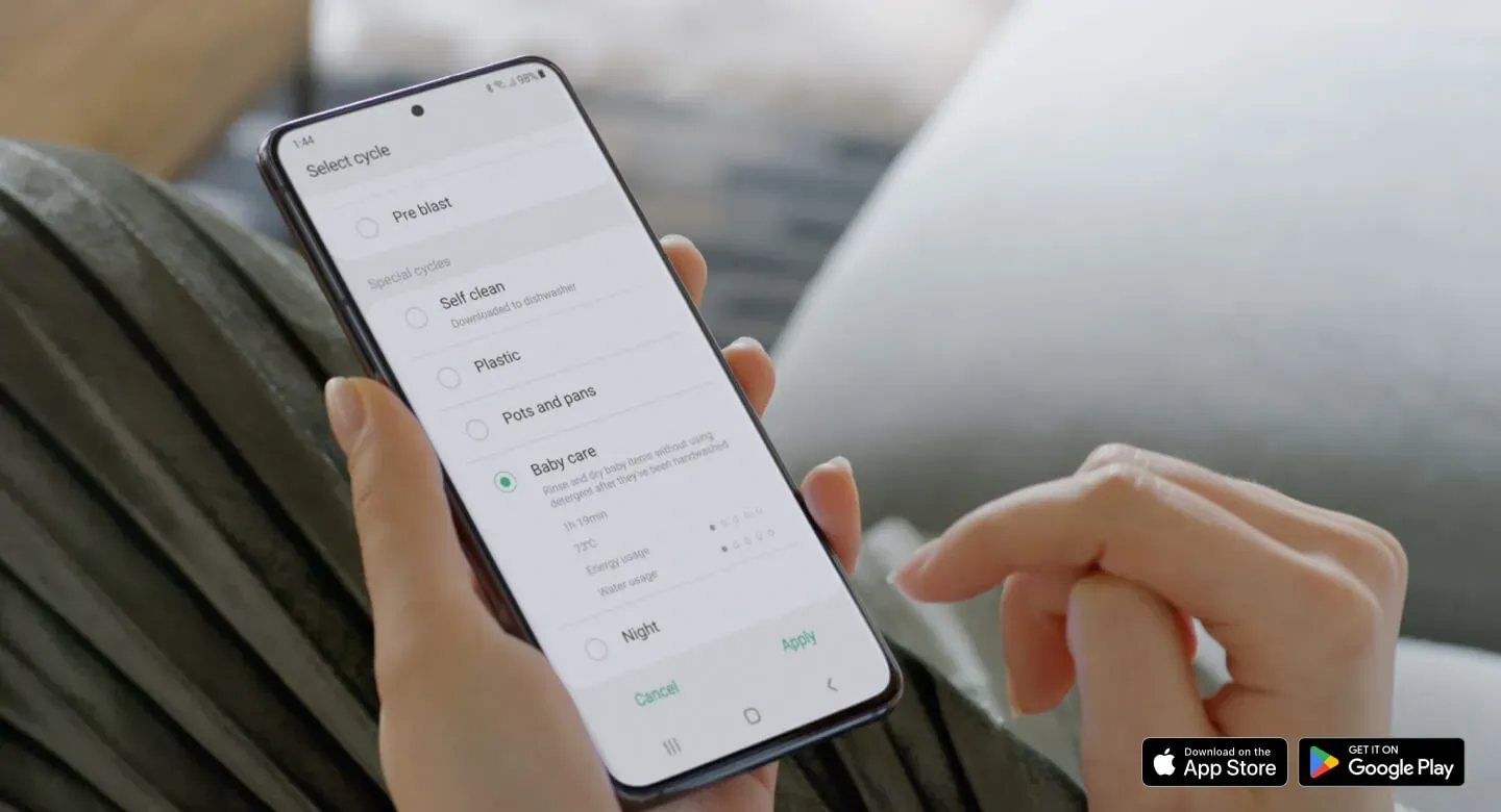 closeup of hand holding smartphone to showcase access to dishwasher with smartthings app