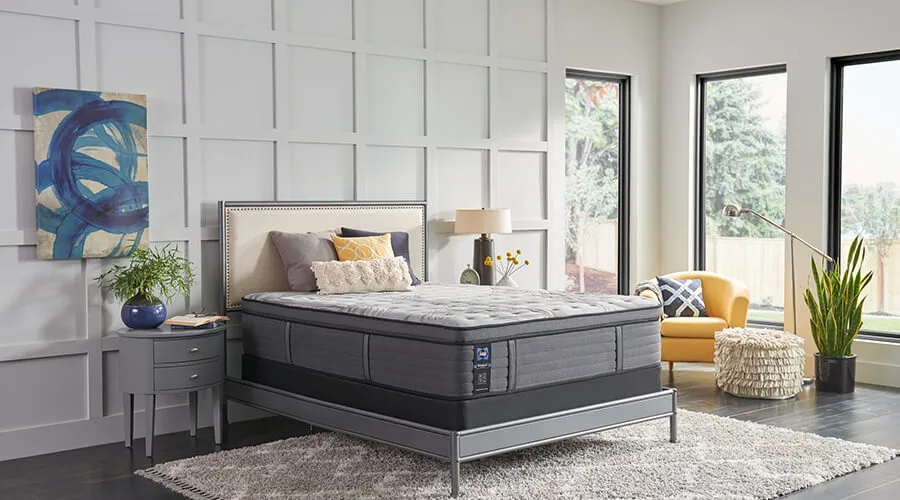 Contemporary mattress and adjustable bed displayed in a bright bedroom