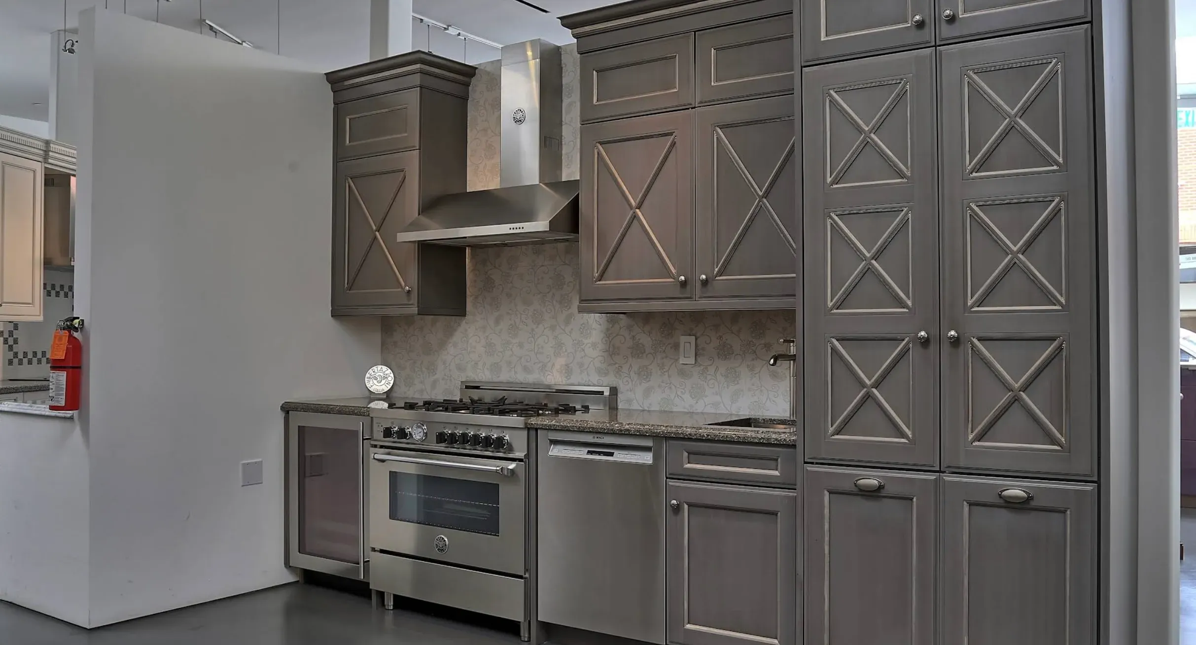 Weathered X-panel cabinetry with pro-style range