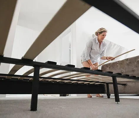 Bed frame being assembled, representing the Frames category