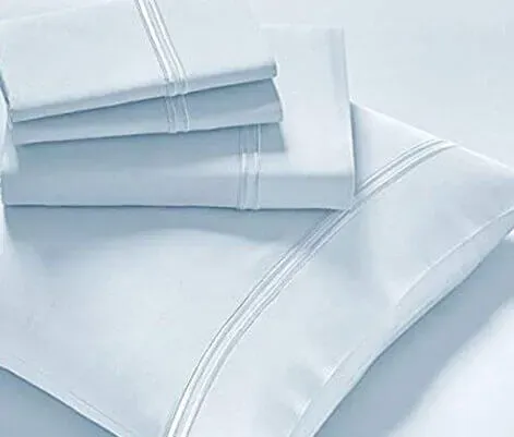 Folded bed linens, representing the Linens category