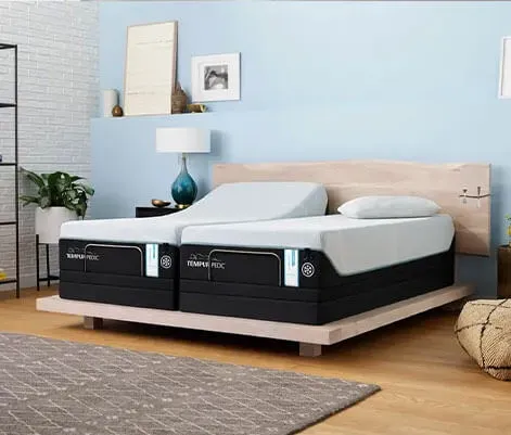 Tempur-Pedic split adjustable mattress on a wooden base