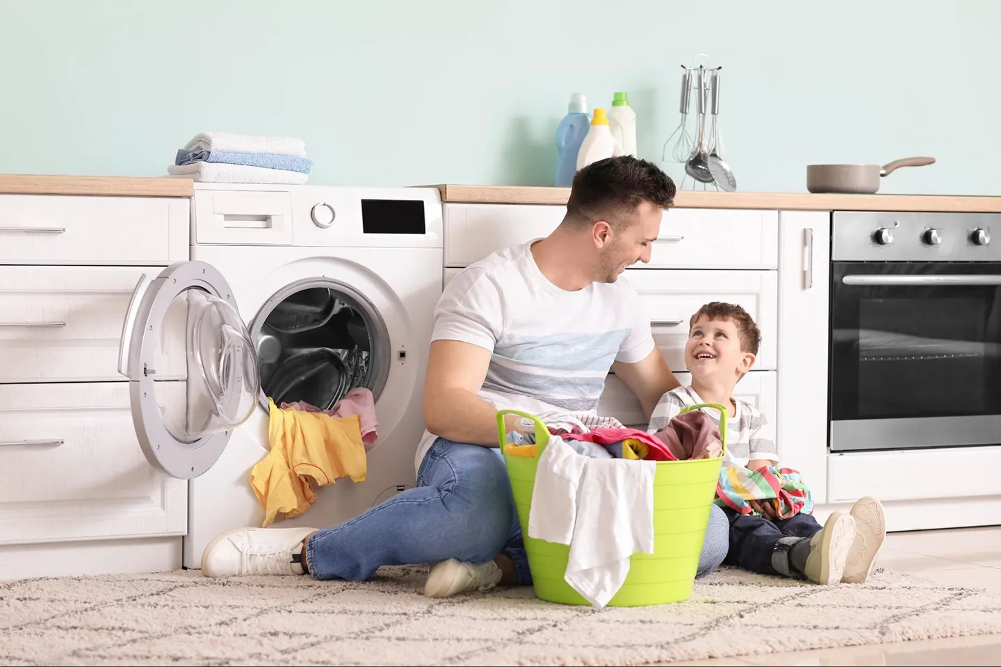 a family washing clothes with efficient appliances in PA