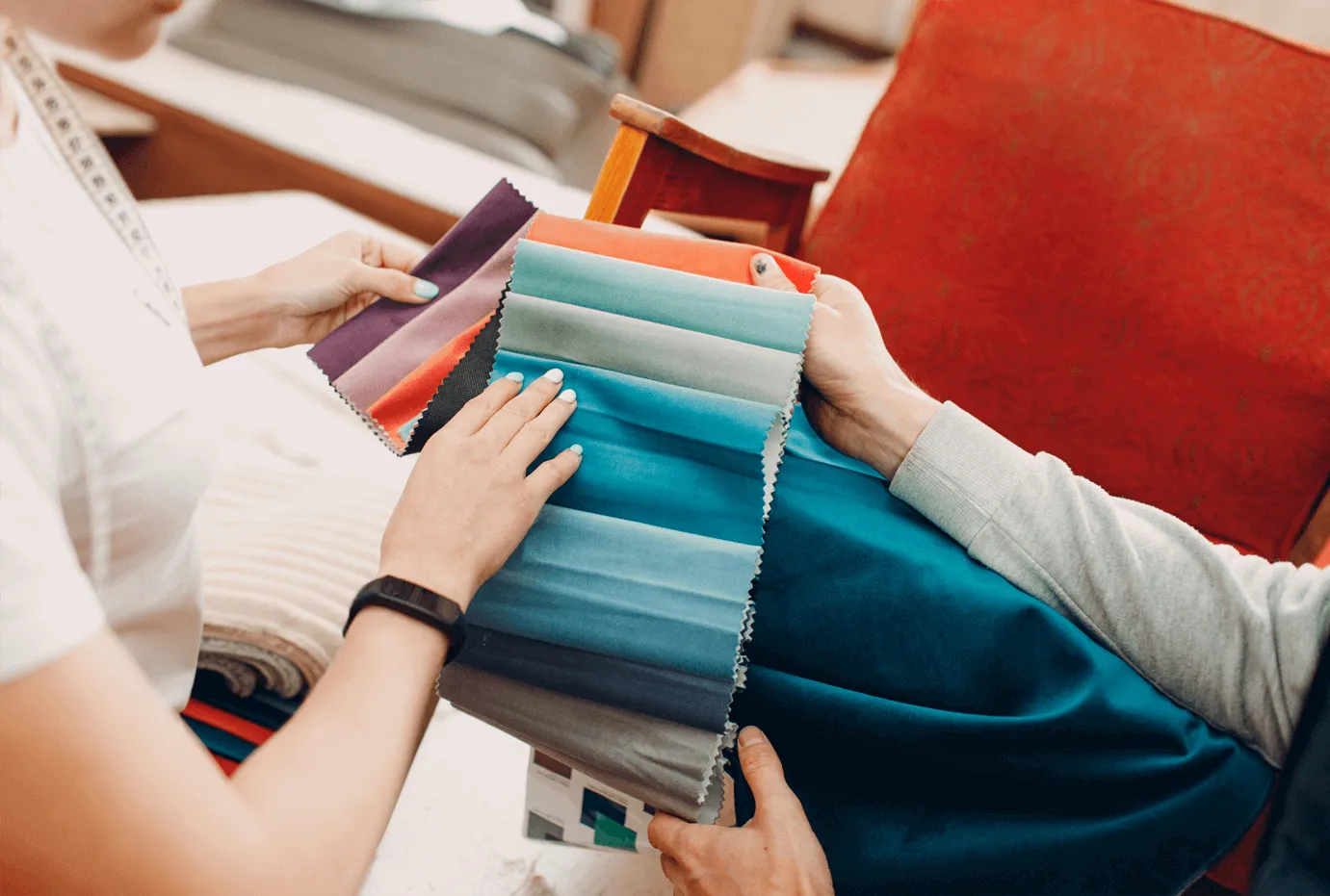 Interior designer reviewing fabric swatches with client