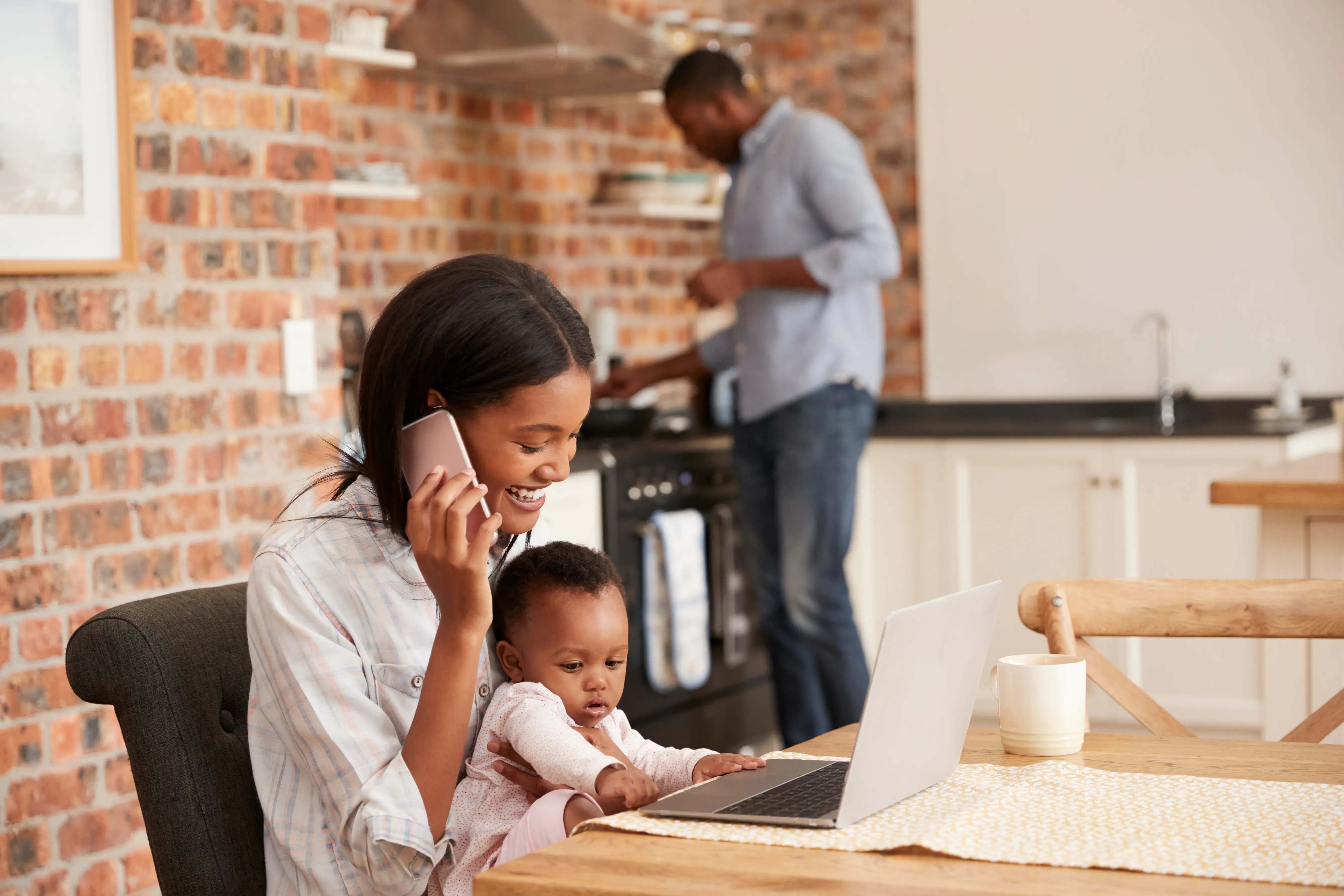 Mother with baby on phone Image