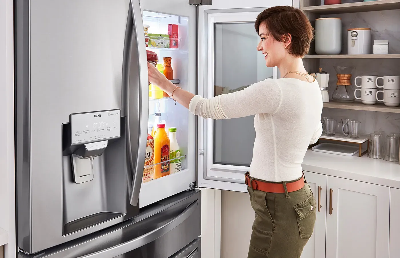 Modern stainless steel refrigerator in a bright kitchen