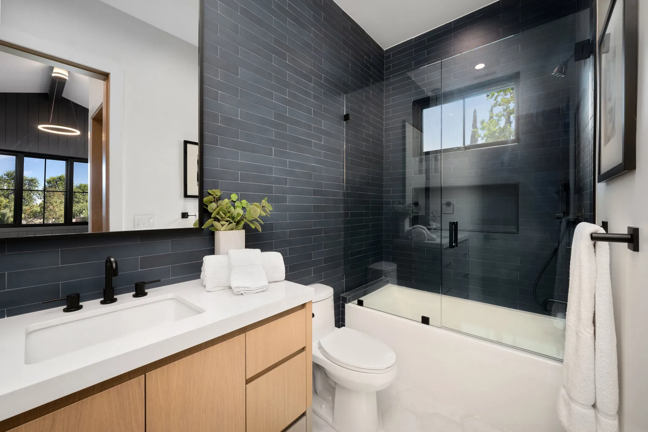 Luxury bathroom featuring marble vanity top and soaking tub countertops by Fabrications LLC