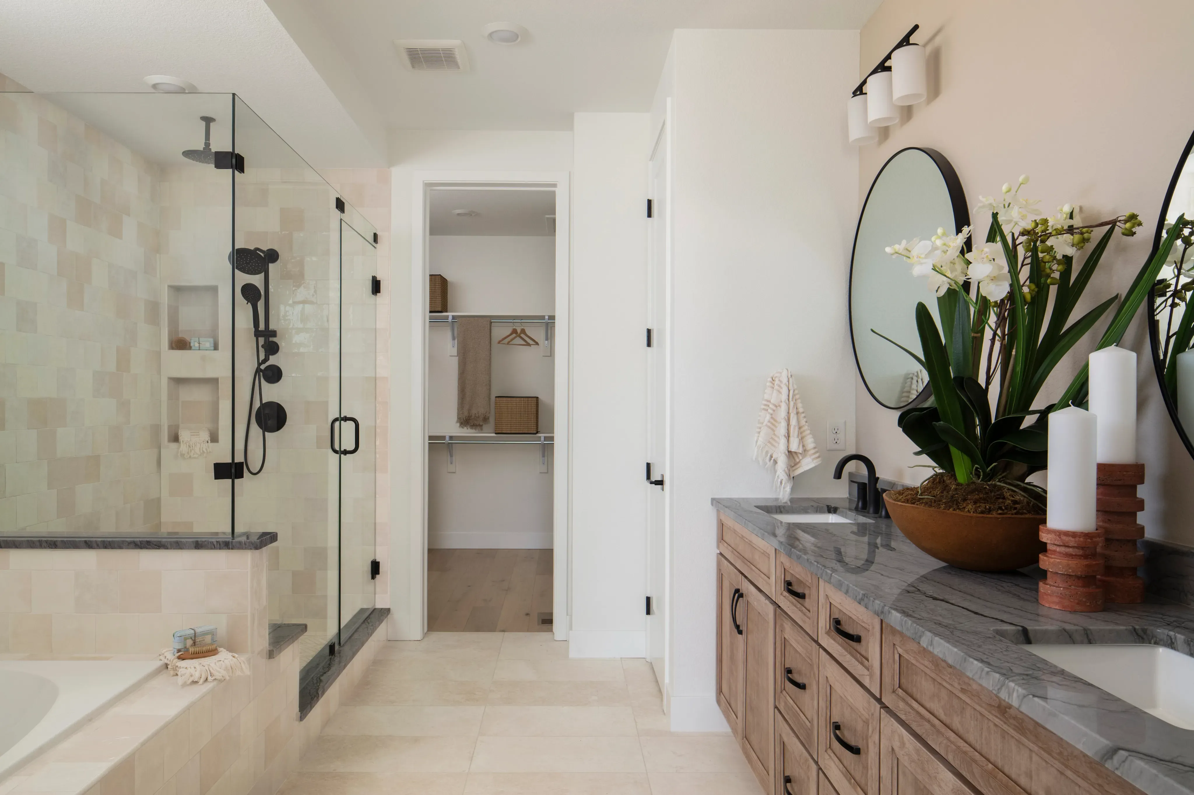 Modern bathroom with floating vanity, vessel sink, and walk-in shower