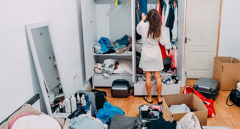 Woman cleaning closet