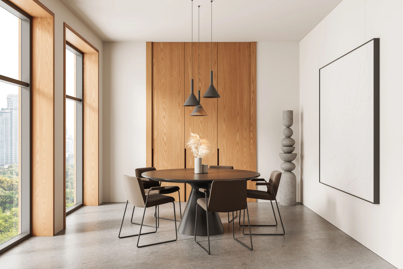 Contemporary dining room with a round table, chairs and pendant lamps
