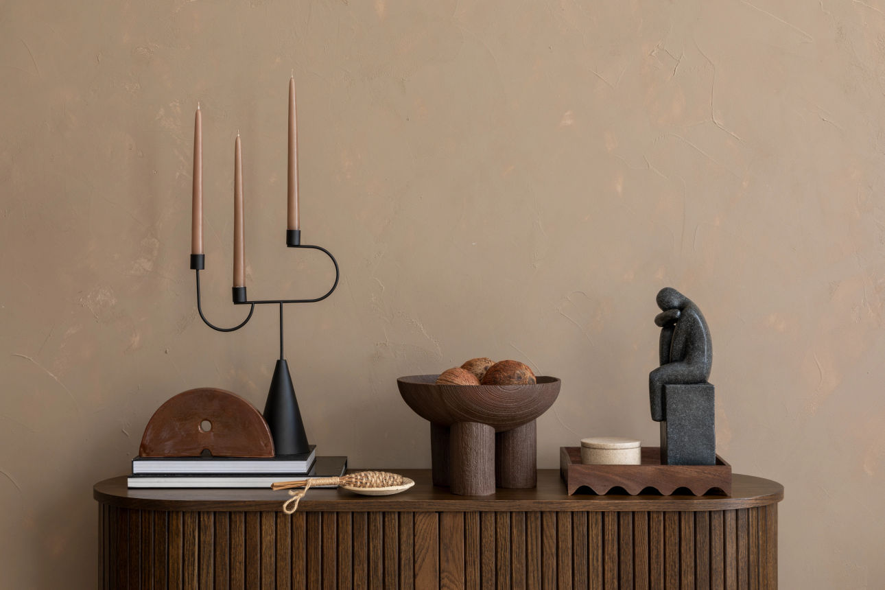 Decorated wooden sideboard styled with vases and home accents