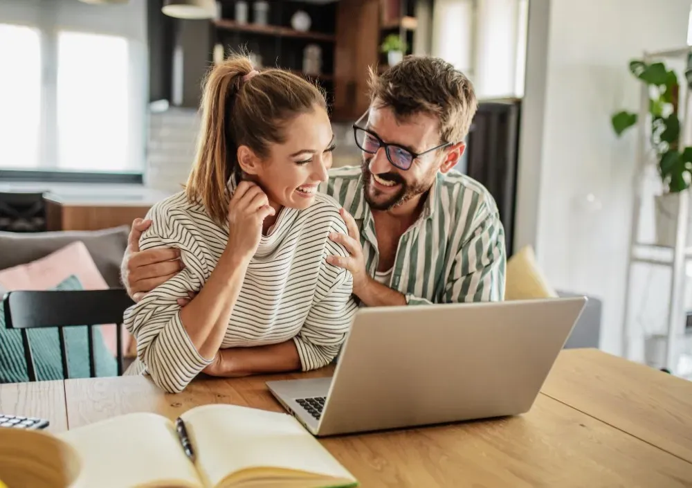 Image of a couple using laptop