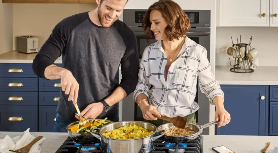 Couple Cooking together in a kitchen