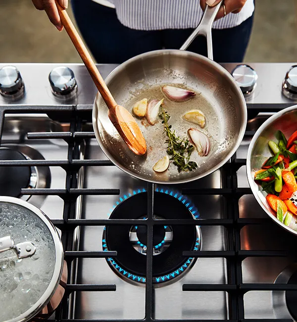 Cooking appliances including gas ranges and microwaves