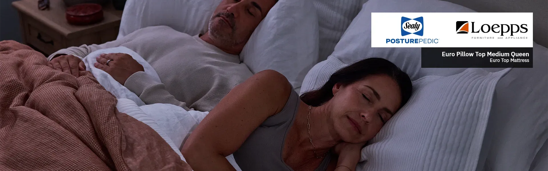 Sealy Posturepedic Promo Banner with a Lifestyle image of a couple sleeping on a bed