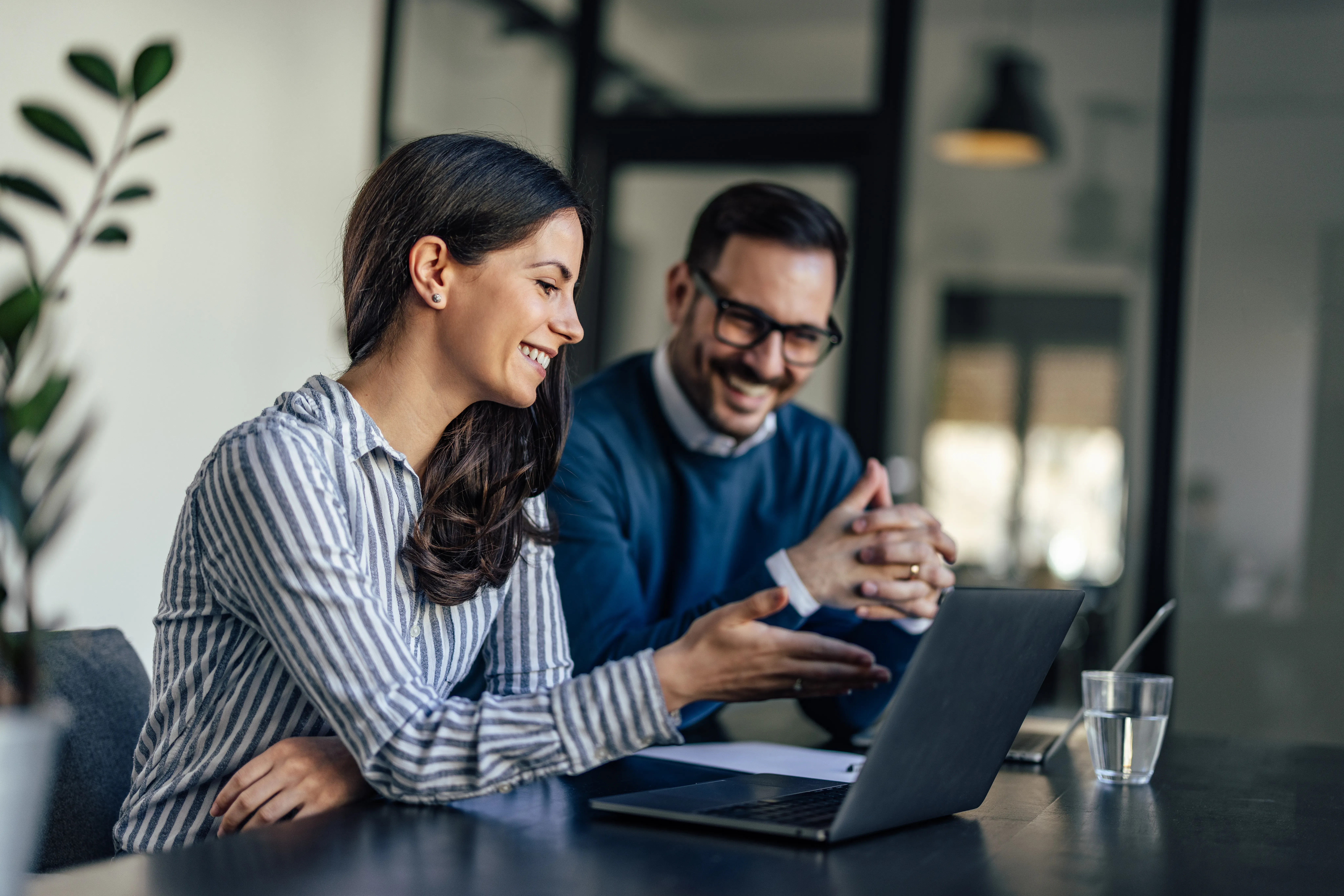 Couple reviewing financing options on a laptop