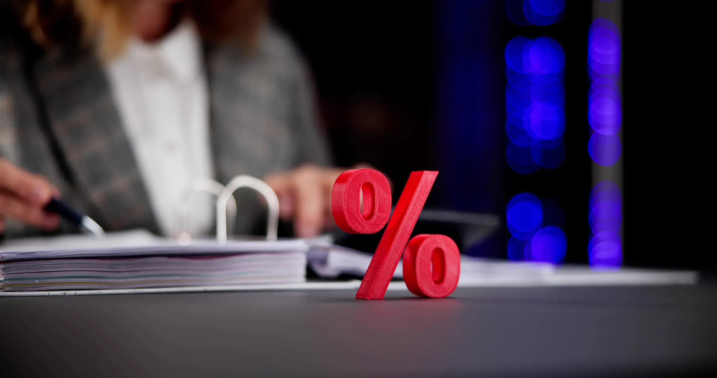 Neon sign and percentage symbol representing Bargain Balcony deals