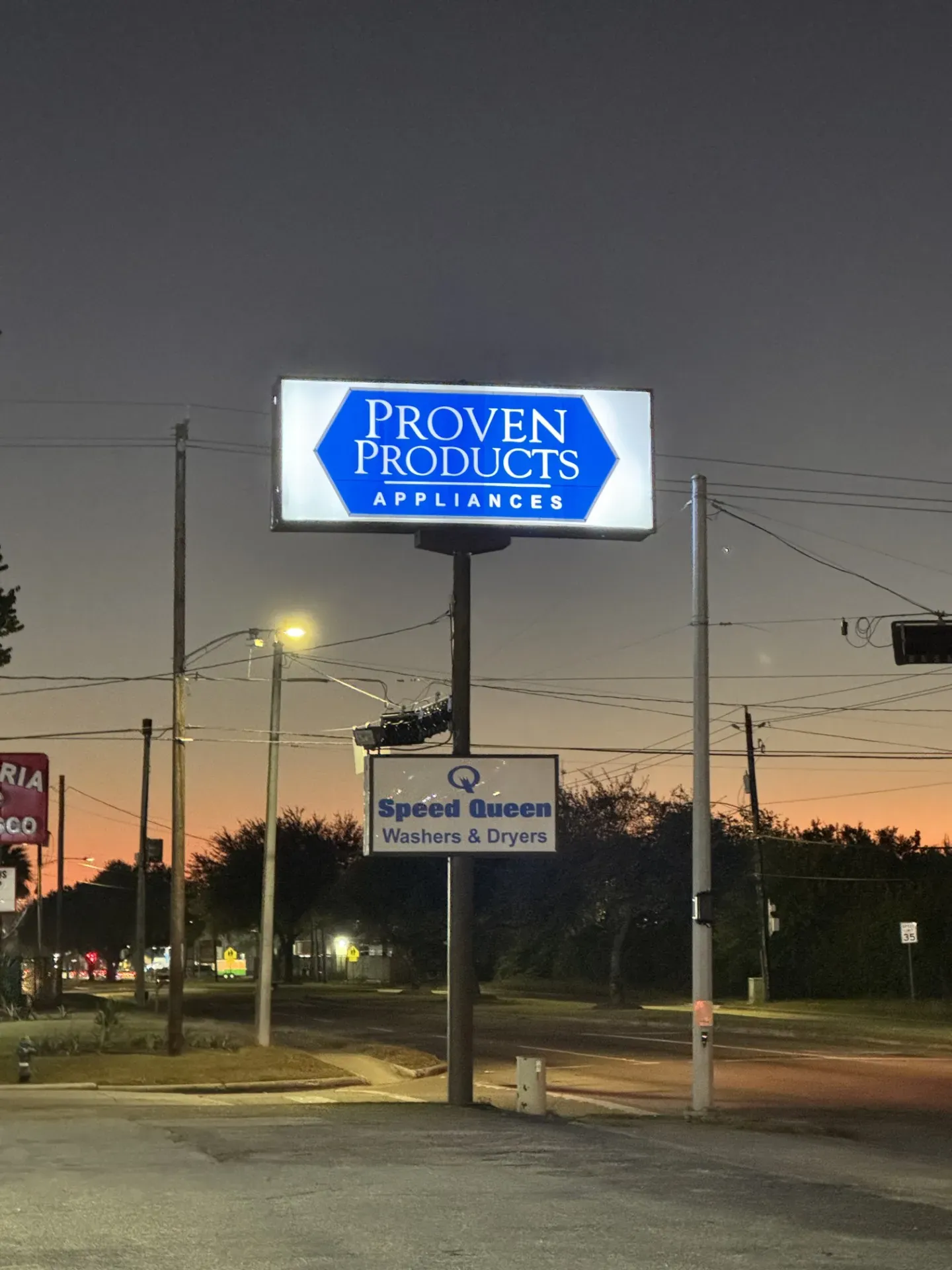 Houston store sign at sunrise.