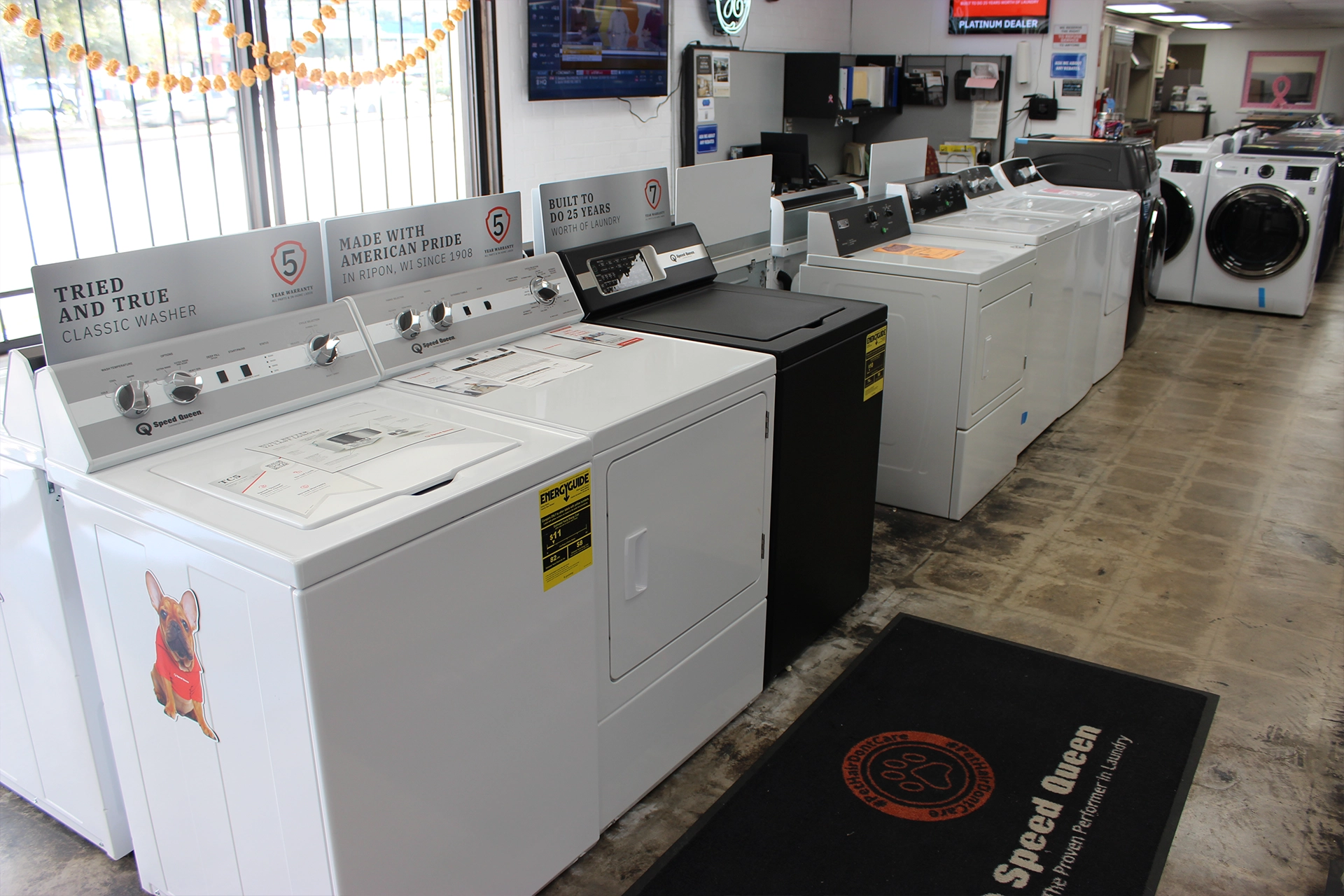 Washer and dryer lineup on the showroom floor.