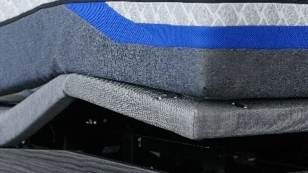 Close-up of an adjustable bed base being adjusted