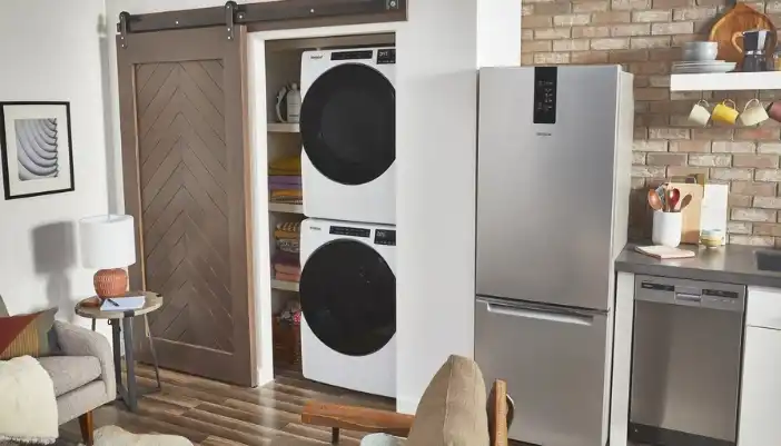 A laundry center in a closet.