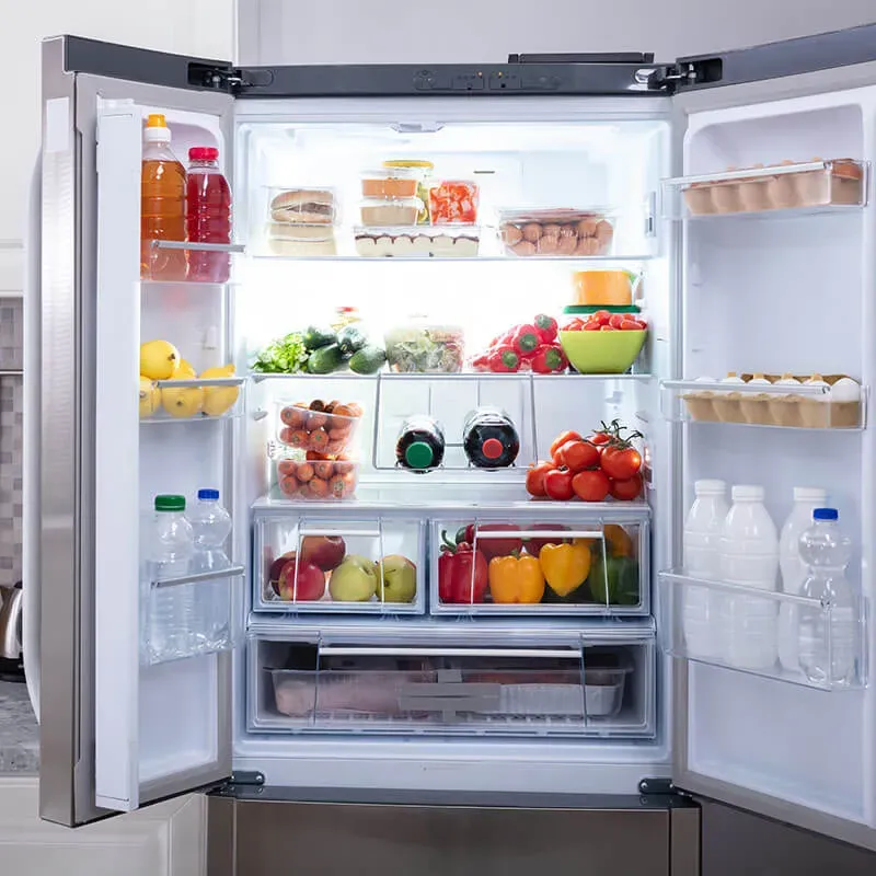 Open refrigerator filled with food and beverages