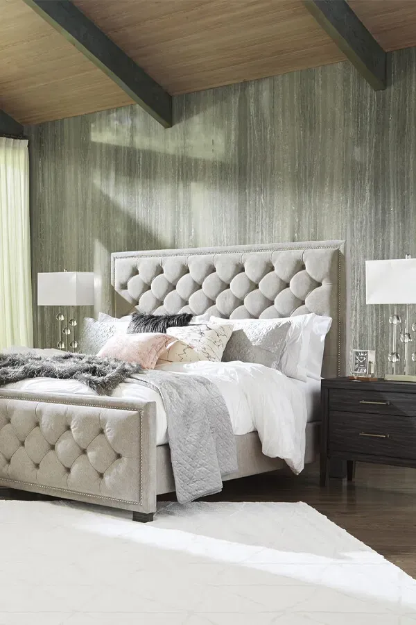 Bedroom with upholstered bed, bedding, and nightstands