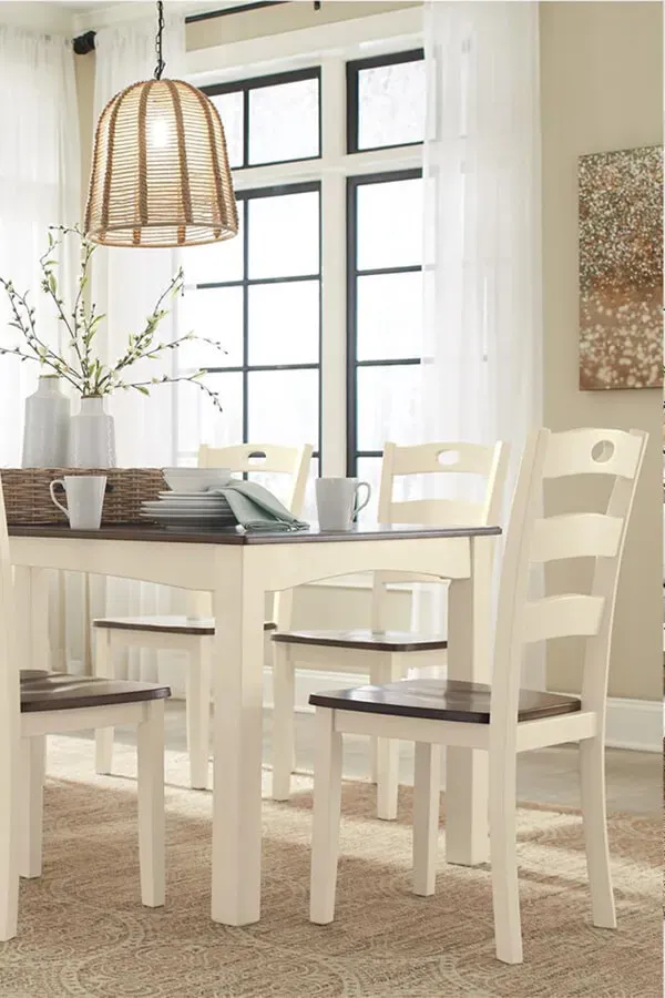 Bright dining room with table, chairs, and pendant light