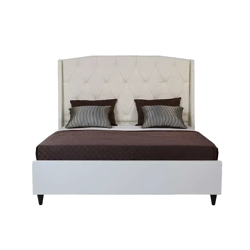 Tufted bedframe with pillows and bedsheets
