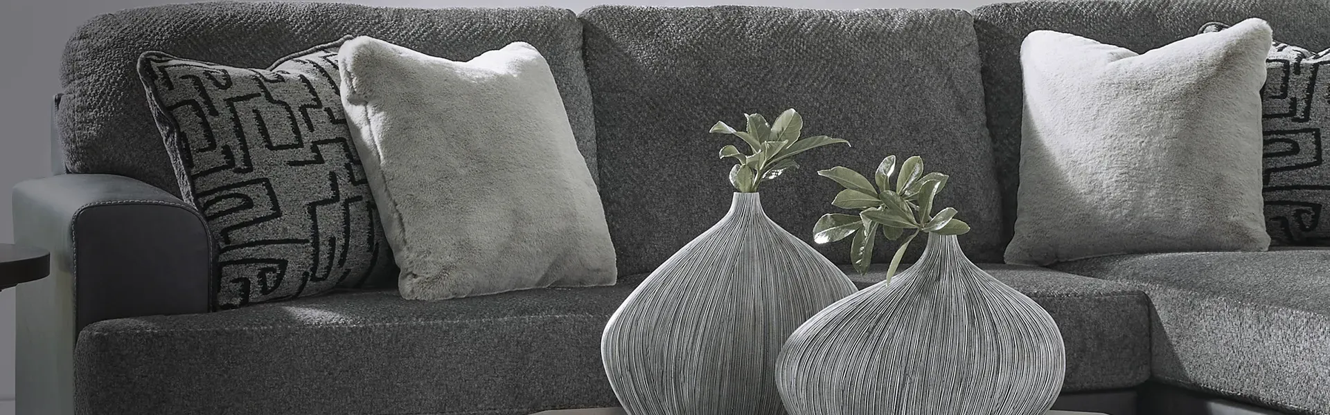 Ashley sectional 1 2990 L-shaped stationary sectional perfect for large family spaces. Durable fabric and versatile color for Missouri homes