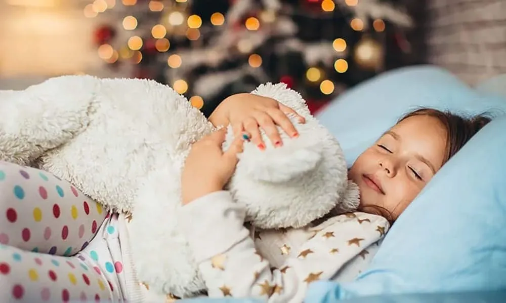 Kid sleeping in bed