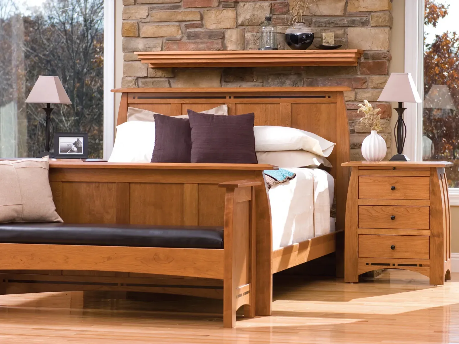 Wood bedroom furniture set with bed and nightstand in a warm, cozy bedroom