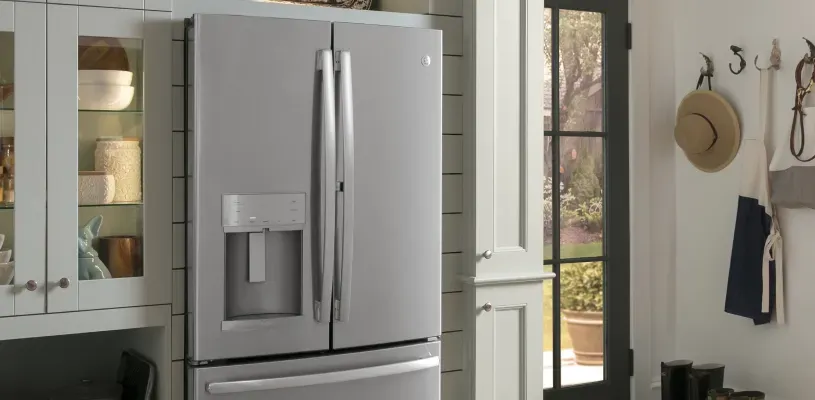 shiplap-walled kitchen with a built-in, large refrigerator