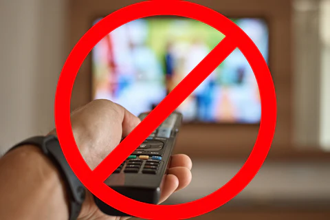 Image of a stop symbol over a tv and remote