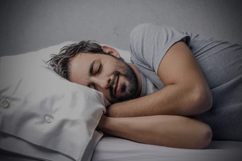 Image of a guy sleeping peacefully