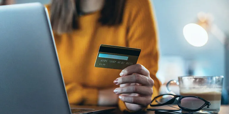 Image of a client paying with a credit card