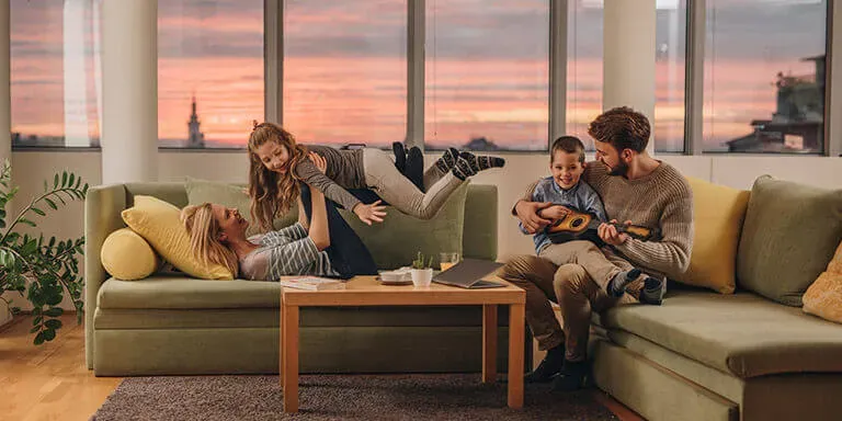 Family relaxing in a living room